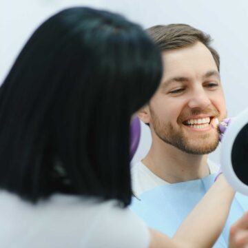 dental-care-concept-handsome-young-guy-at-the-den-2 smile makeover in turkey hero