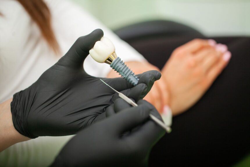 dentist-explaining-teeth-model-to-female-patient-2025-02-12-19-22-19-utc best dental implant brands turkey